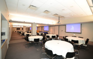 9th Floor Conference Room Suite - Meeting Space in NYC. Three adjoining rooms combined, set up with banquet tables.