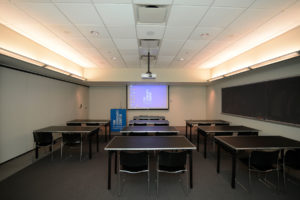9th Floor Conference Room Suite - Meeting Space in NYC. Room set up for class or presentation with desks.