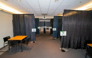 Proshansky Auditorium - Auditorium Rental in NYC. Breakout room set up with separate table areas. Photo credit: Alex Irklievski