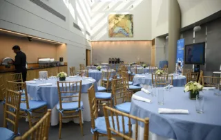 Skylight4-1400-0925 Kelly Skylight Room - Flexible Event Space in NYC. Table setting for corporate dinner, overlooking The Graduate Center's Dining Commons.