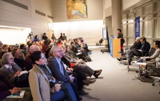 Skylight6-1400-0925 Kelly Skylight Room - Flexible Event Space in NYC. Past event image - space set up for a presentation with presenters at the front and a full audience.